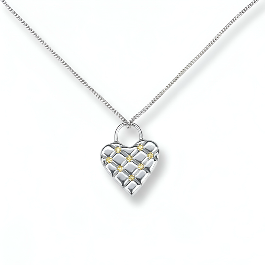 Silver heart-shaped and sapphires necklace with a chain on a white background