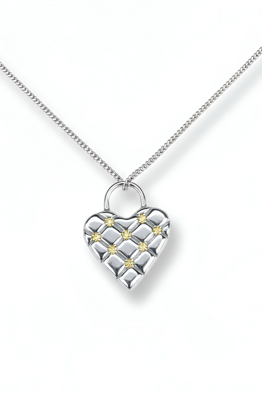 Silver heart-shaped and sapphires necklace with a chain on a white background