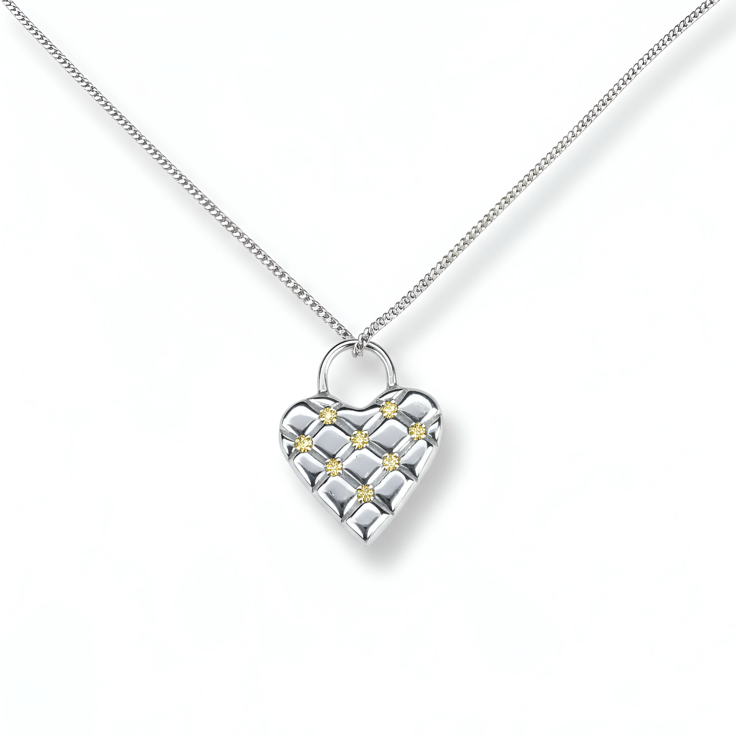 Silver heart-shaped and sapphires necklace with a chain on a white background