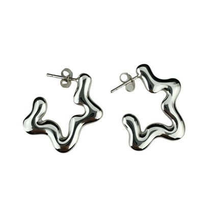 Pair of silver star-shaped earrings on a white background