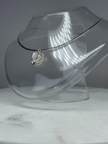 Sterling silver rose necklace on model, neckline close-up — Nounou Studio