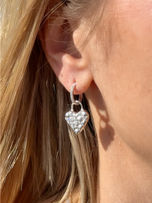Handcrafted lucky heart earrings, close-up of quilted texture — Nounou Studio