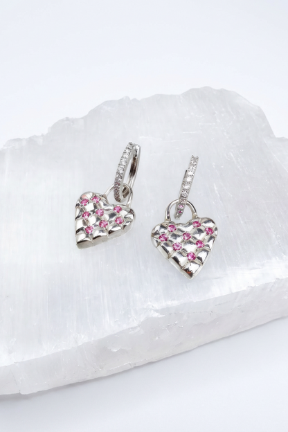 Handcrafted lucky heart earrings, close-up of quilted texture and gemstones— Nounou Studio