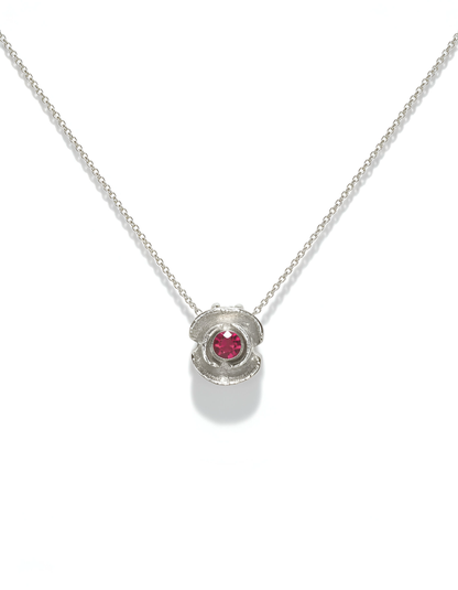 Sterling silver poppy flower necklace with ruby on white background — Nounou Studio