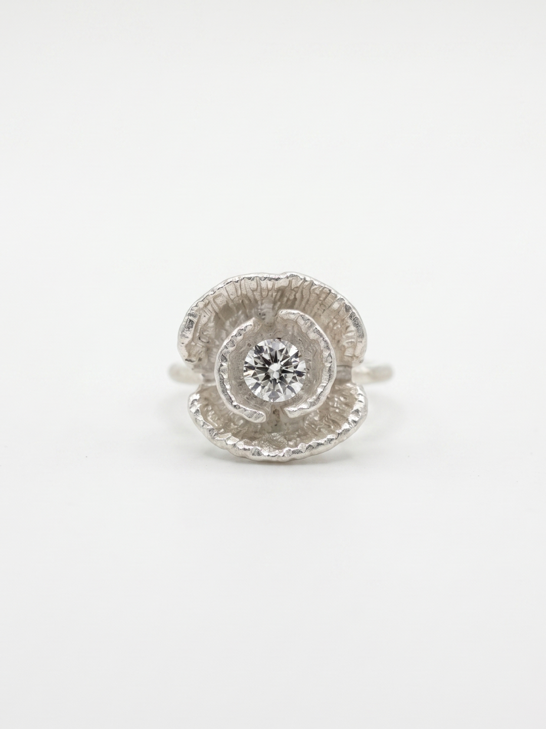 Silver poppy ring detail shot showing texture and gemstone — Nounou Studio