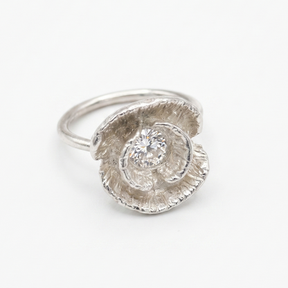 Silver poppy ring detail shot showing texture and gemstone — Nounou Studio