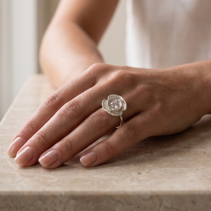 Silver poppy ring worn on model's hand, close-up — Nounou Studio