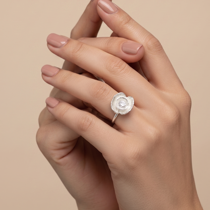 Silver poppy ring worn on model's hand, close-up — Nounou Studio
