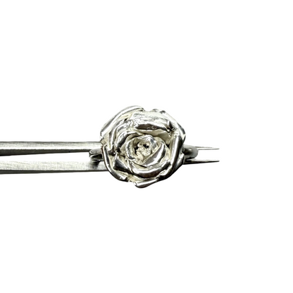 Silver rose ring on a white background