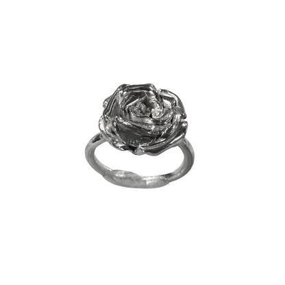 Silver rose-shaped ring on a white background